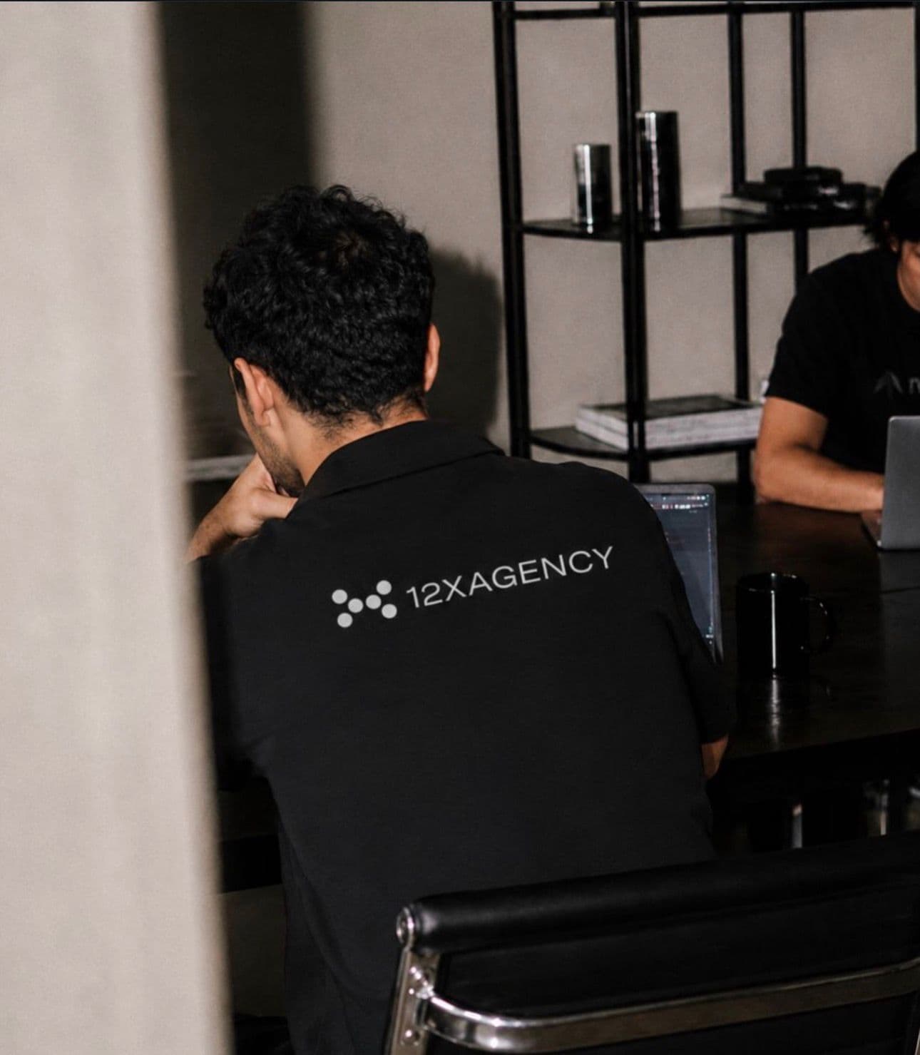 A 12X Agency team member working at the office